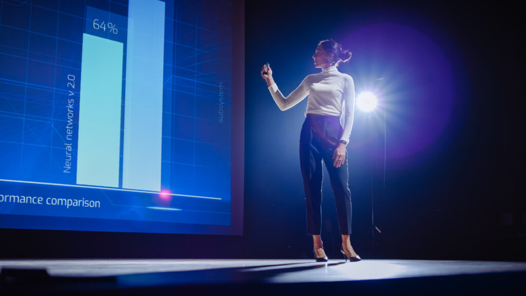 woman presenting at conference